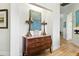 Hallway with wood floors and decorative furniture pieces at 1234 Harbor Town Way, Venice, FL 34292