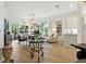 Bright living room featuring white walls, large windows, hardwood floors, and comfortable seating at 1234 Harbor Town Way, Venice, FL 34292