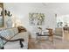 Cozy living area features stylish furniture, light wood floors, and bright decor at 1234 Harbor Town Way, Venice, FL 34292