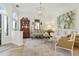 Bright and airy living room with wood floors, designer furniture, and elegant decor at 1234 Harbor Town Way, Venice, FL 34292