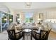 Bright living room featuring elegant furniture, neutral colors, and ample natural light at 1234 Harbor Town Way, Venice, FL 34292