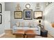 Cozy living area with comfortable seating, decorative wall art, and warm lighting at 1234 Harbor Town Way, Venice, FL 34292