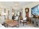 Spacious living area with an open floor plan, grandfather clock, and elegant decor at 1234 Harbor Town Way, Venice, FL 34292