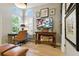 Comfortable home office featuring a desk, wall decor, and plenty of natural light at 1234 Harbor Town Way, Venice, FL 34292