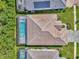A bird's eye view of a home with a pool and meticulous landscaping at 12404 Destin Loop, Venice, FL 34293