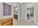 Open hallway showing an opening to a bathroom on the left and the living room on the right at 12404 Destin Loop, Venice, FL 34293