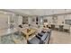 Open-concept living room features comfortable seating, stylish decor, and a seamless flow to the kitchen at 12404 Destin Loop, Venice, FL 34293