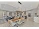 Open floor plan features a combined living, dining, and kitchen space with modern finishes and lighting at 12404 Destin Loop, Venice, FL 34293