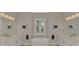 Bright bathroom with dual vanities, large window, and modern fixtures at 12404 Destin Loop, Venice, FL 34293