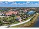 Aerial view of community with bocce ball, clubhouse, and surrounding homes at 13092 Rinella St, Venice, FL 34293