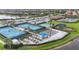 Community amenities showcasing tennis courts, playgrounds, and garden plots set in a beautifully landscaped area at 13092 Rinella St, Venice, FL 34293