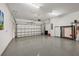 Spacious garage with epoxy floor, high ceilings and ample room for vehicles and storage at 13092 Rinella St, Venice, FL 34293