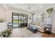 Bright living room with a view of the pool and modern decor, offering a serene and inviting space at 13092 Rinella St, Venice, FL 34293