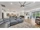 Open-concept living room that flows into the kitchen and dining area with tile floors and plenty of space at 13092 Rinella St, Venice, FL 34293