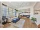 Bright living room featuring modern decor, light wood flooring, and a neutral color palette at 13092 Rinella St, Venice, FL 34293