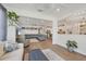 Open concept living space with modern decor, light wood flooring, and a seamless flow between rooms at 13092 Rinella St, Venice, FL 34293