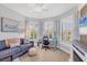 This home office offers ample light, comfortable seating, and a modern desk at 13092 Rinella St, Venice, FL 34293