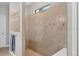 Enjoy this walk-in shower with tiled walls and a built-in bench at 13092 Rinella St, Venice, FL 34293