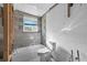 Unfinished bathroom featuring bathtub, toilet, and walls needing finishing, with exposed framing at 1350 Holiday Dr, Englewood, FL 34223