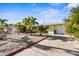 Charming home with a well-maintained yard and a paved driveway, providing ample parking and curb appeal at 1350 Holiday Dr, Englewood, FL 34223