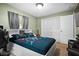 The bedroom has a gaming set up, good natural light and ample closet space at 13608 Westshire Dr, Tampa, FL 33618