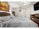 Cozy bedroom with a fireplace, offering a peaceful retreat with a queen bed and integrated TV at 13608 Westshire Dr, Tampa, FL 33618