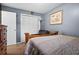 Bedroom showcasing a comfortable bed, closet, and classic decor at 13608 Westshire Dr, Tampa, FL 33618