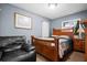 Bedroom showcasing cozy decor, natural light, and comfortable sitting area at 13608 Westshire Dr, Tampa, FL 33618