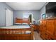Bedroom featuring wood furnishings, dresser, and a sunlit window view at 13608 Westshire Dr, Tampa, FL 33618