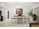 Dining room boasts an elegant chandelier, stylish furnishings, and tile flooring at 13608 Westshire Dr, Tampa, FL 33618