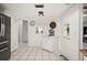 The kitchen includes stainless steel refrigerator and ample white counter and cabinet space at 13608 Westshire Dr, Tampa, FL 33618