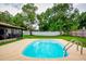 Backyard pool, patio, lanai and fenced yard at 13608 Westshire Dr, Tampa, FL 33618