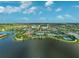 An expansive aerial view showcasing the beautiful community layout, lakes, and recreational amenities at 13841 Campoleone St, Venice, FL 34293