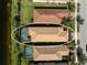 Stunning aerial view of the home and screened-in pool, surrounded by lush landscaping at 13841 Campoleone St, Venice, FL 34293