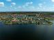 Aerial shot showcases the community's layout, surrounded by lakes and lush landscaping at 13841 Campoleone St, Venice, FL 34293