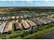 Beautiful neighborhood aerial view, with the house highlighted and showcasing lake views at 13841 Campoleone St, Venice, FL 34293