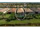 Wonderful aerial view of the home showcasing the screened-in pool and lush landscaping at 13841 Campoleone St, Venice, FL 34293