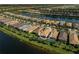Beautiful community aerial view, with the house highlighted and lake views at 13841 Campoleone St, Venice, FL 34293