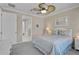 Comfortable bedroom featuring neutral walls and a large bed with light colored bedding and pillows at 13841 Campoleone St, Venice, FL 34293