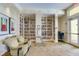 The library area has extensive bookshelves, comfortable seating, and a quiet space for reading at 13841 Campoleone St, Venice, FL 34293