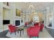 The lounge area has comfortable seating, a cozy fireplace, and elegant lighting at 13841 Campoleone St, Venice, FL 34293
