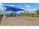 Fun playground area with slides, swings, climbing structures, and shade, providing a safe and enjoyable space at 13841 Campoleone St, Venice, FL 34293