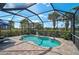 Sparkling pool in screened lanai offers a refreshing escape with privacy and scenic views of the property at 13841 Campoleone St, Venice, FL 34293