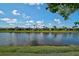 Beautiful water view showcasing serene canal reflecting the sky, complemented by lush green banks at 13841 Campoleone St, Venice, FL 34293