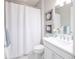 Bright bathroom featuring a shower/tub combo, white vanity, and tasteful decor at 13871 Miranese St, Venice, FL 34293