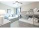 Bright bedroom with a bunk bed, trundle bed, and coastal decor at 13871 Miranese St, Venice, FL 34293