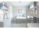 Bright bedroom featuring a bunk bed with trundle, calming decor, and a mounted tv at 13871 Miranese St, Venice, FL 34293
