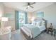 Comfortable bedroom with neutral tones, coastal decor, and a window with natural light at 13871 Miranese St, Venice, FL 34293