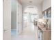 Inviting hallway with tile flooring leads to the open living spaces at 13871 Miranese St, Venice, FL 34293
