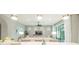 Open-concept living area features modern lighting, neutral tones, large windows and seamless transition to outdoor space at 13871 Miranese St, Venice, FL 34293